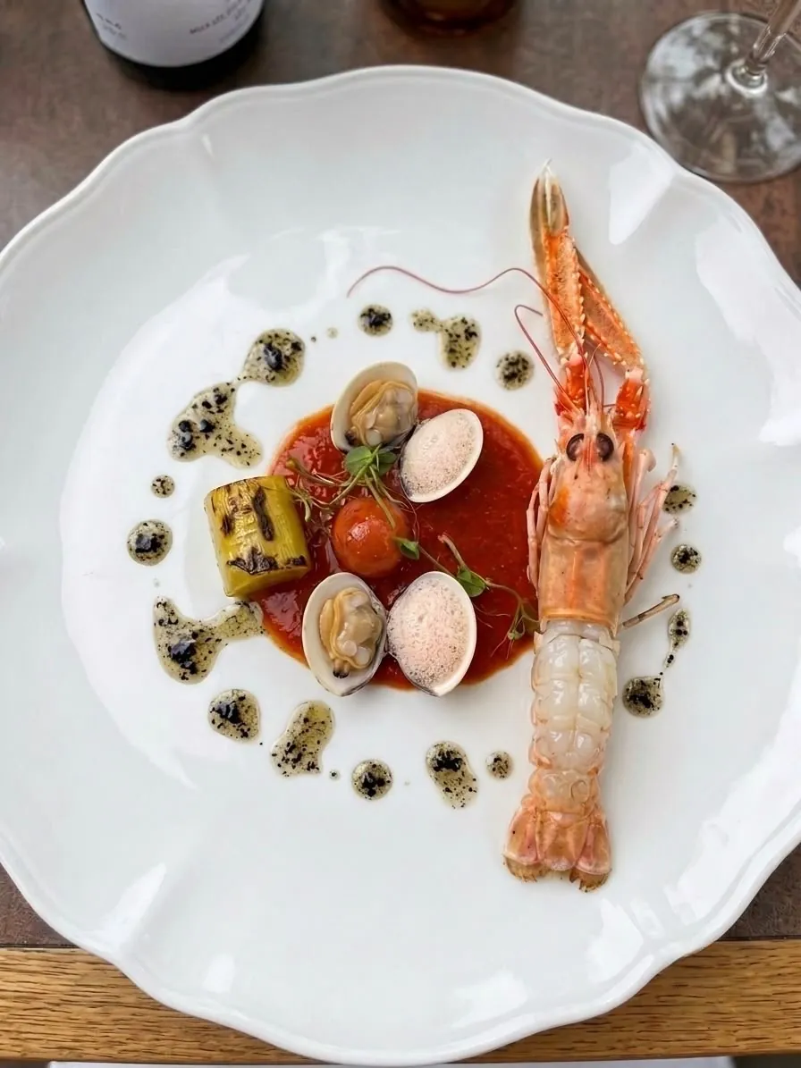 Langoustine with clams, tomato and grilled leek